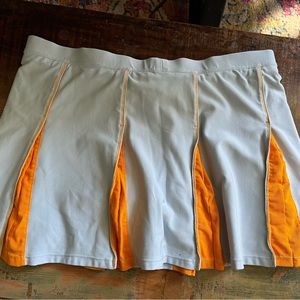 Nike pale blue and orange pleated Tennis Skirt with built in shorts Size medium.